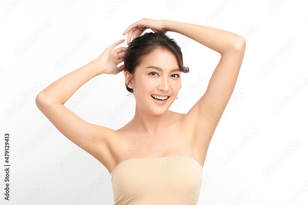 Beautiful Young Asian woman lifting hands up to show off clean and hygienic armpits or underarms on white background, Smooth armpit cleanliness and protection concept Beautiful Young Asian woman lifting hands up to show off clean and hygienic armpits or underarms on white background, Smooth armpit cleanliness and protection concept