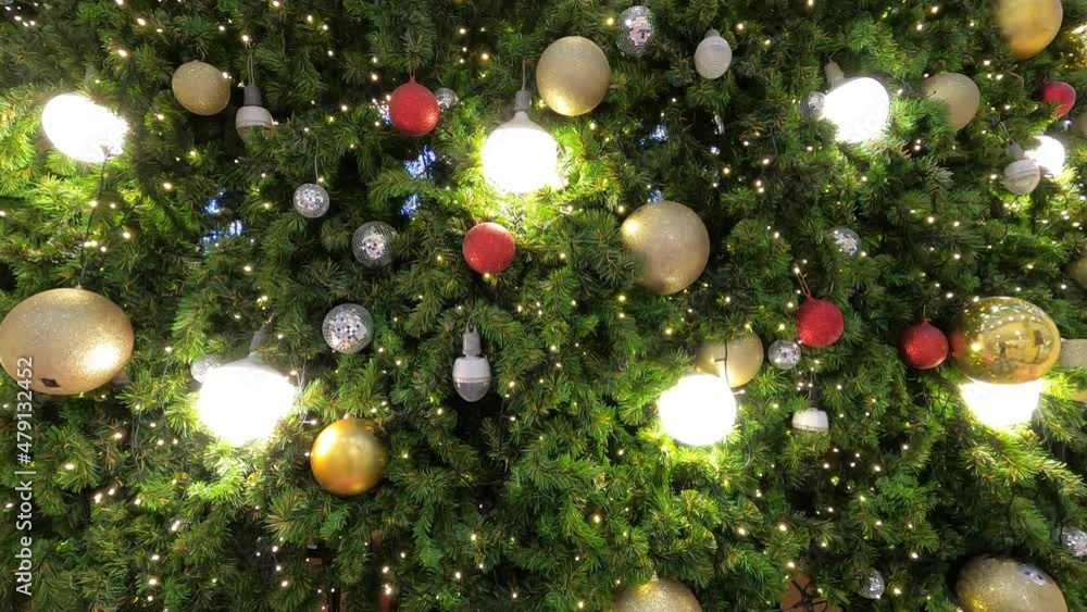 The twinkling lights on the Christmas tree look beautiful and impressive on Christmas day. The twinkling lights on the Christmas tree look beautiful and impressive on Christmas day.