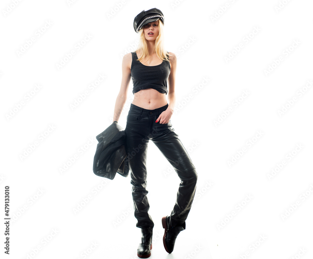 Woman in leather jacket an hat. Fashion model, beautiful young woman posing with vogue fashionable dress, studio shot, full length.