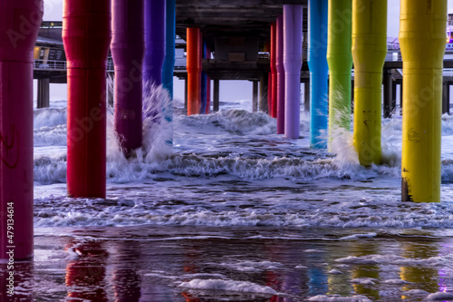 colorful pillars in the surf of the North Sea on the beach