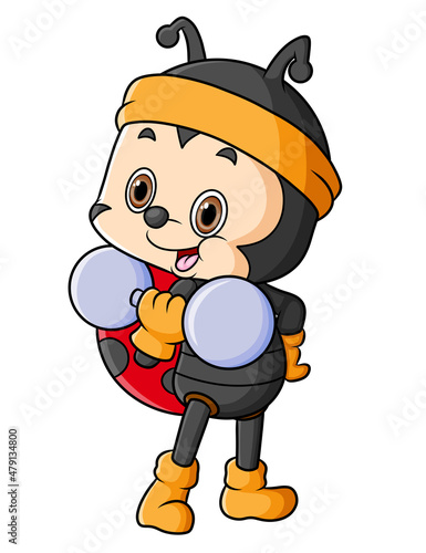 The strong ladybug is exercising with a barbell