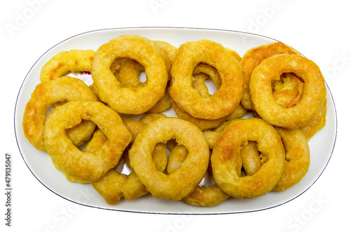 Fried calamari rings on plate isolated on white background