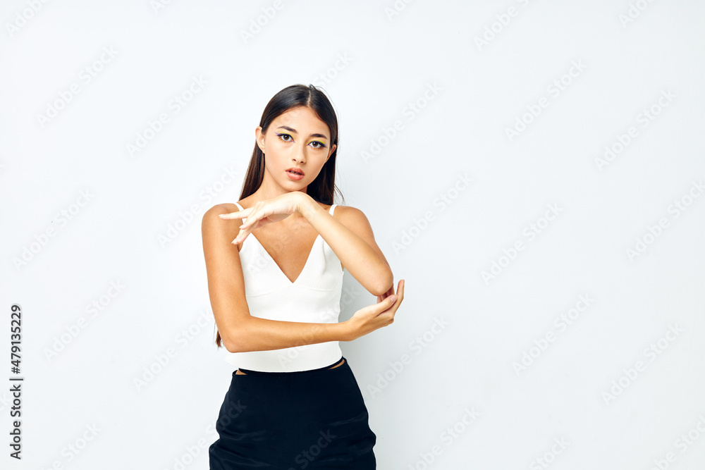 young woman white t shirt hand gestures charm isolated background unaltered young woman white t shirt hand gestures charm isolated background unaltered