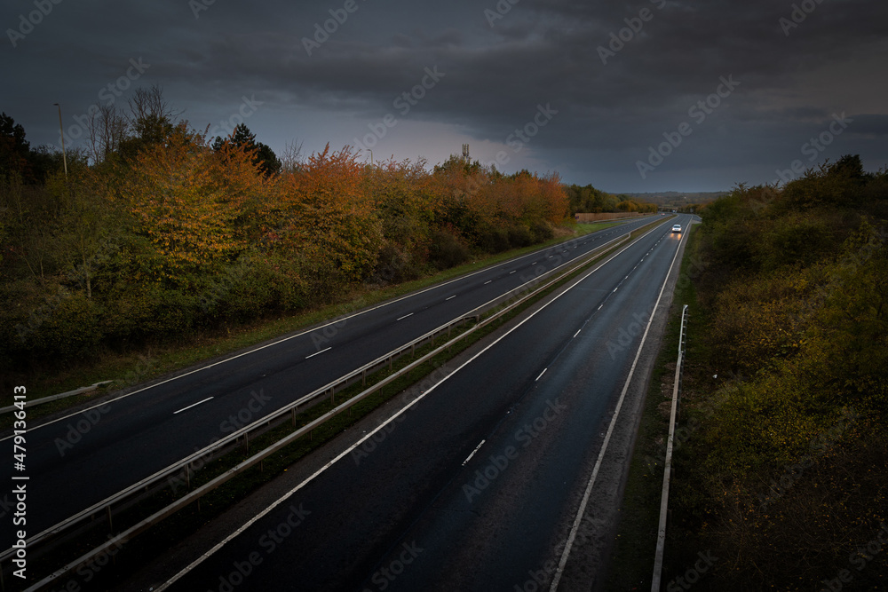 Car driving on quiet uk dual carriageway Car driving on quiet uk dual carriageway