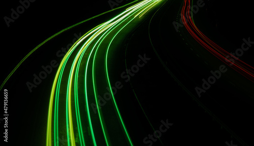 Night road lights. Lights of moving cars at night. long exposure red, blue, green, orange.