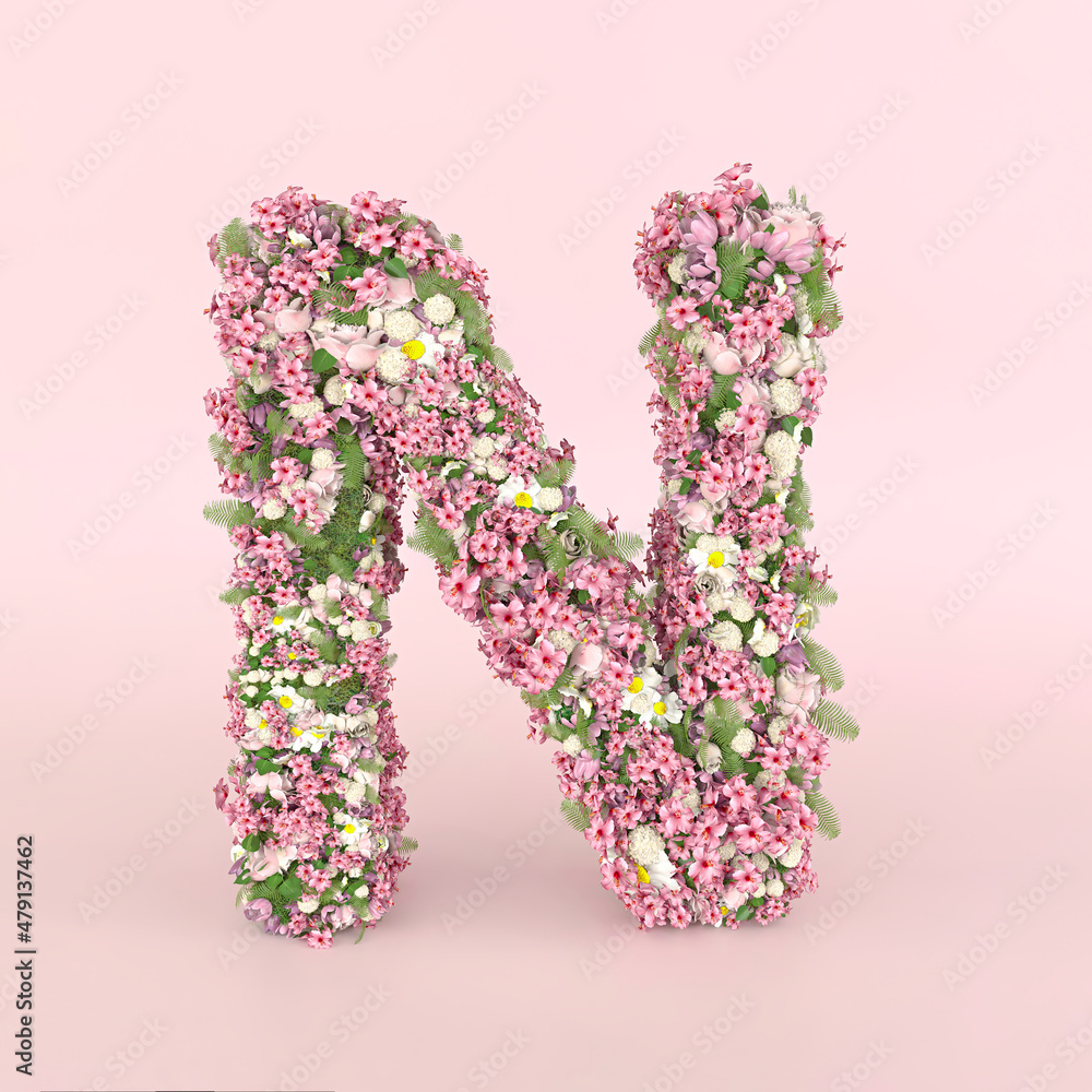 Creative letter N concept made of fresh Spring wedding flowers. Flower font concept on pastel pink background..