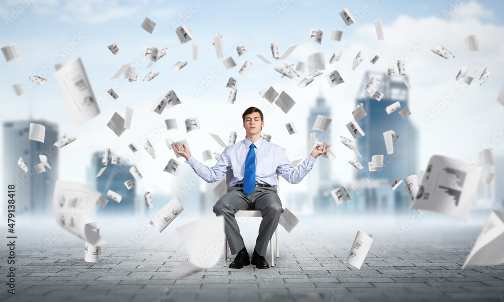businessman meditates on office chair businessman meditates on office chair