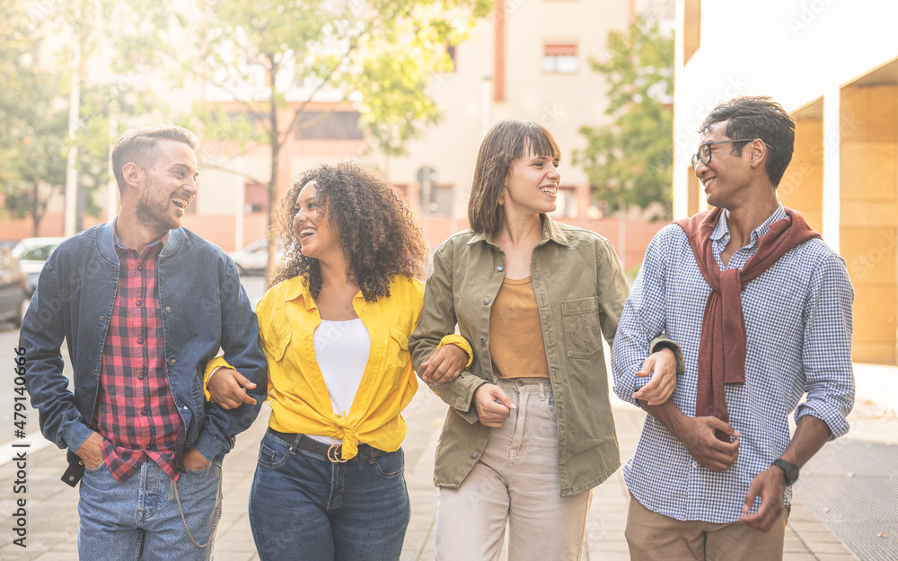 group of multiracial students walking in the city, young people smling and laughing while having a break of university lesson, warm light effect group of multiracial students walking in the city, young people smling and laughing while having a break of university lesson, warm light effect