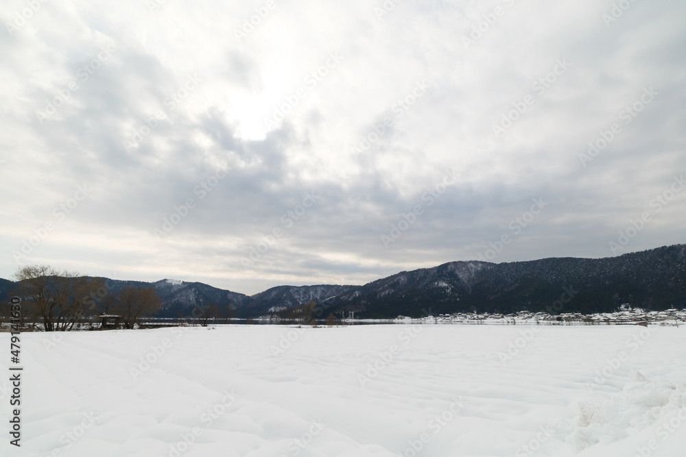 Landscape of snow-covered plains in Shiga Prefecture, Japan in mid-winter.