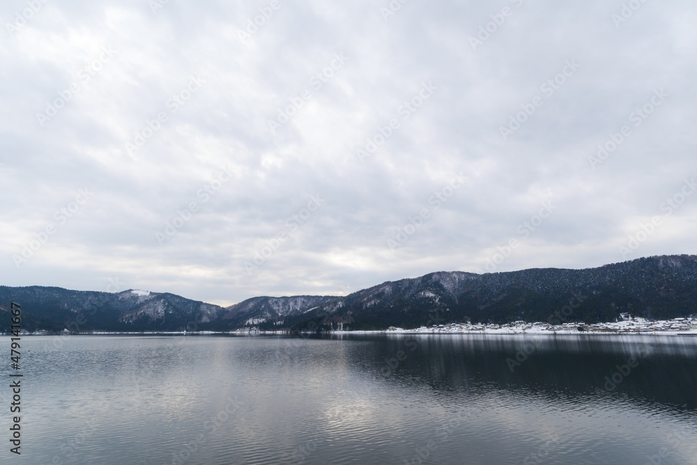 A view of Lake Yogo in Shiga Prefecture in midwinter, with the sky reflecting off the lake surface.