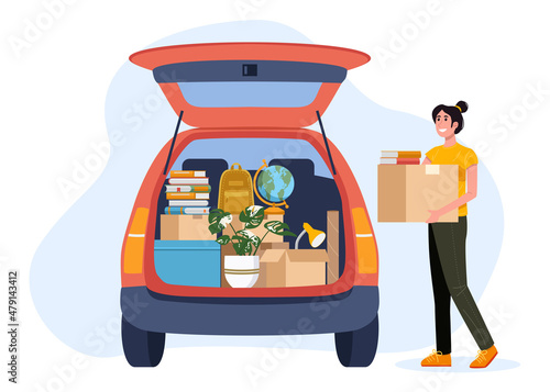 College student packing car and moving into dormitory or apartment.