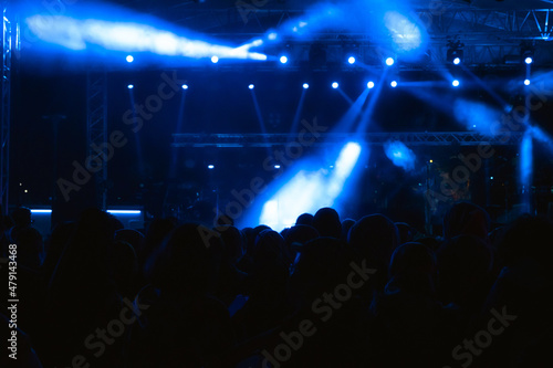 Concert background. Blue and foggy spotlights on the stage.