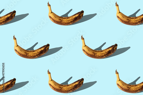 Fotografija Rotten bananas on blue background