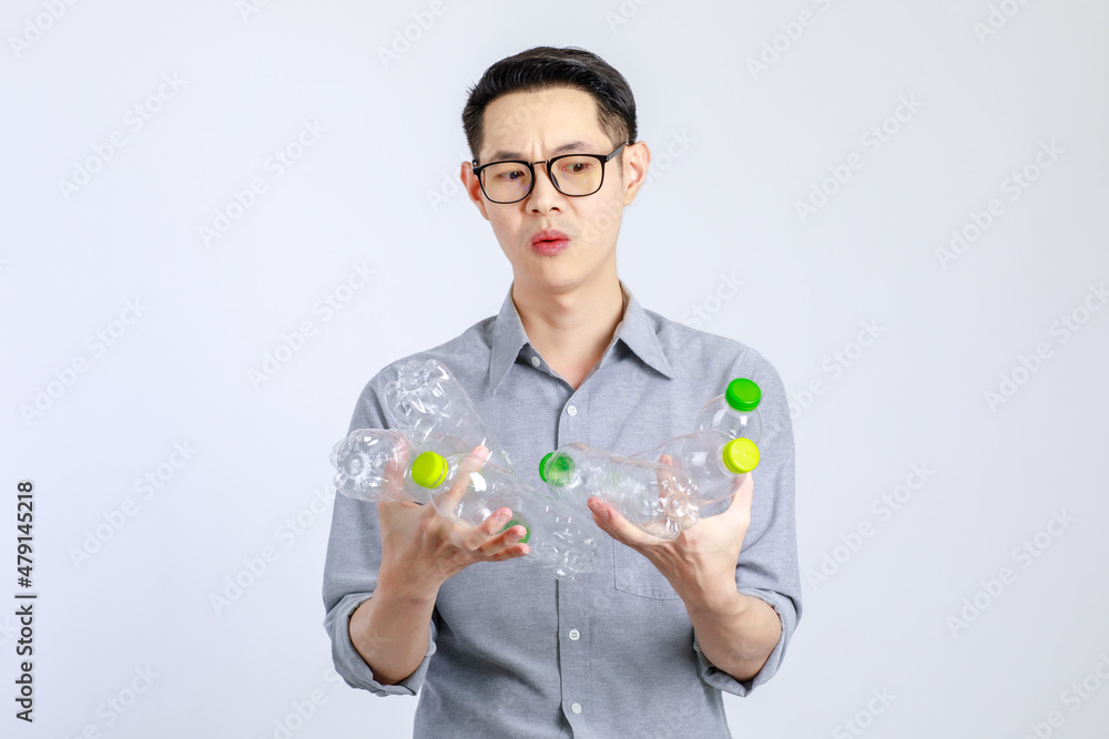 Young, friendly face asian man smile happy, dressed casually campaign say no plastic, reducing plastic, reducing global warming, studio light shot isolated on white background. Environment concept Young, friendly face asian man smile happy, dressed casually campaign say no plastic, reducing plastic, reducing global warming, studio light shot isolated on white background. Environment concept