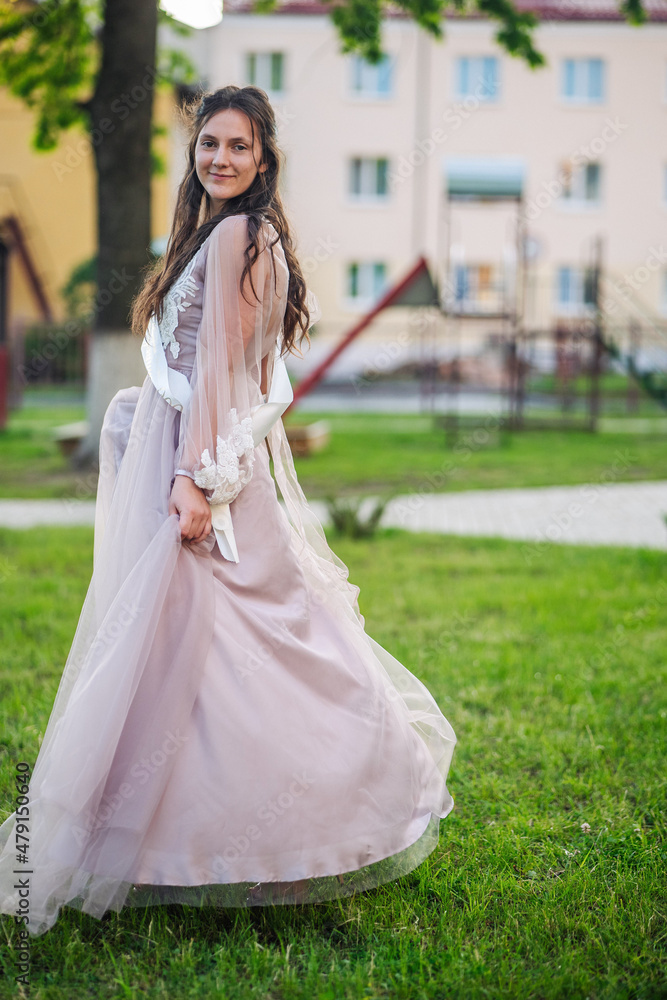 Beautiful schoolgirl in dress at the prom at school. Beautiful schoolgirl in dress at the prom at school.