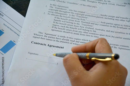 business contract agreement document form for sign with hand and pen