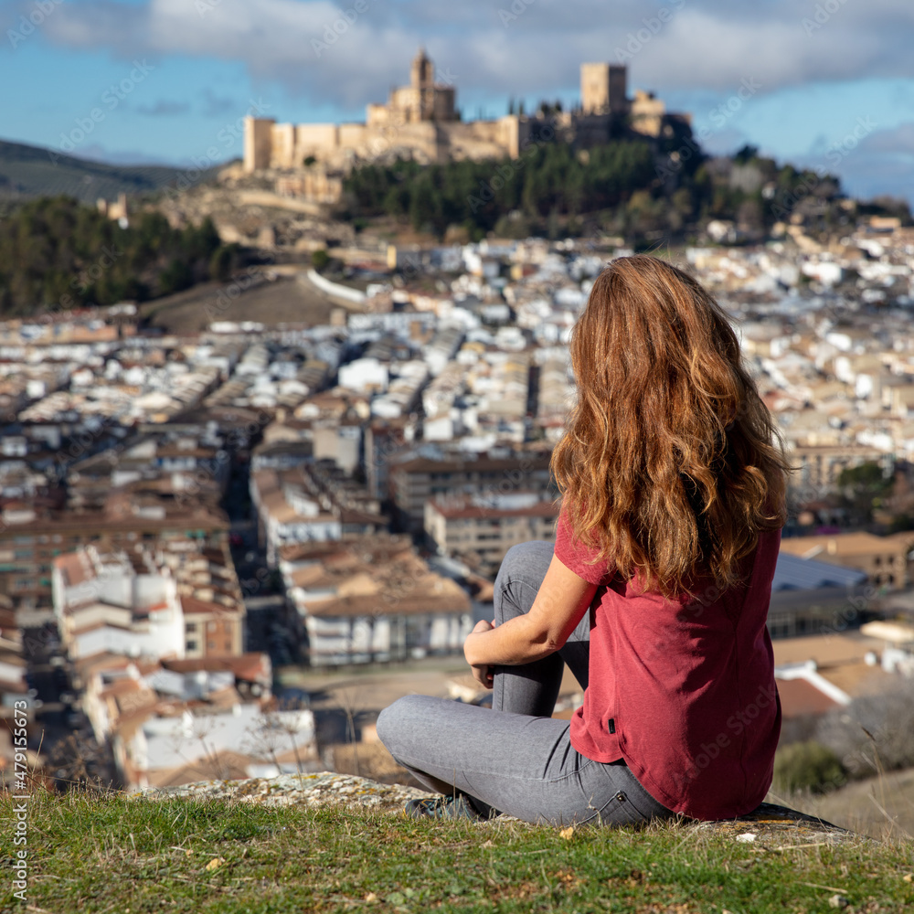 woman tourist enjoying view of castle- Andalousia
