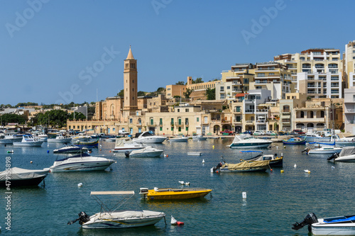 Boats on Marsaskala Harbour with the Parish Church in the background, Marsaskala, Malta.