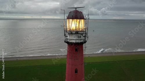 Lighthouse tower Lange Jaap in Den Helder drone aerial footage 5K along the sea near the island of Texel in North Holland, The Netherlands. photo