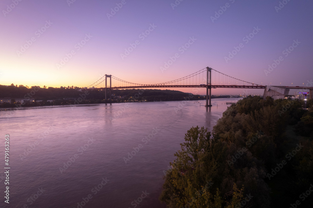 Obraz premium AERIAL SHOOT OF THE DAQUITAINE BRIDGE IN BORDEAUX AT SUNRISE