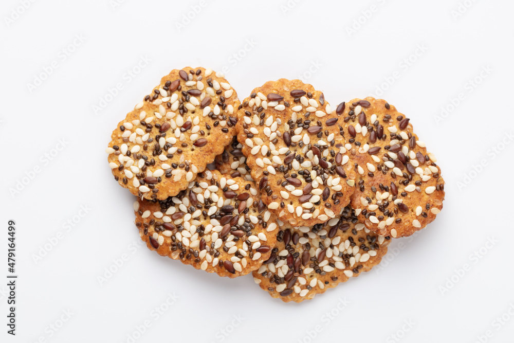 Tasty crackers with seeds on the white background. Tasty crackers with seeds on the white background.