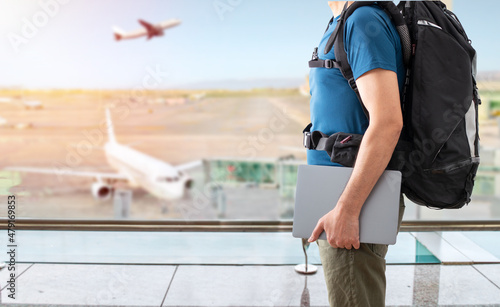 Quadro su tela Unrecognizable digital nomad man traveling the world working with his laptop at