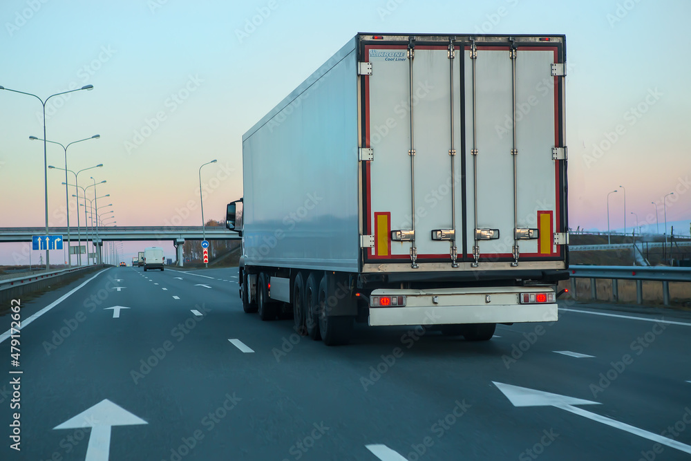 Truck move under viaduck.