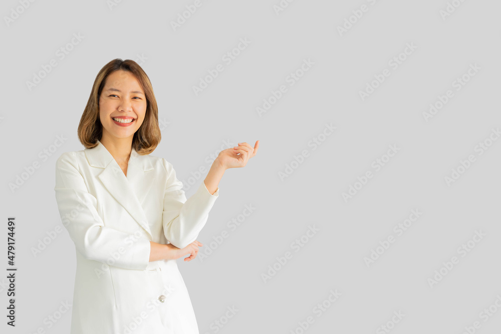 close up asian businesswoman smile during make hand gesturing (add content) isolated on gray color background for business lifestyle and design concept close up asian businesswoman smile during make hand gesturing (add content) isolated on gray color background for business lifestyle and design concept