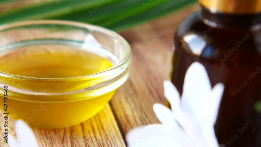pipette and oil in a small container on table pipette and oil in a small container on table