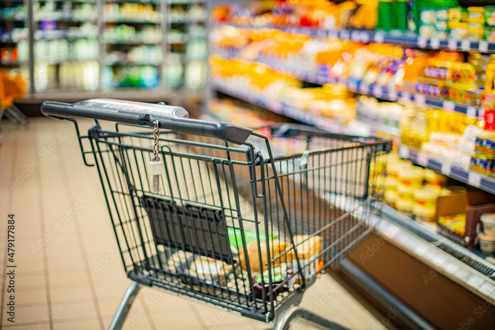 A shopping cart in a supermarket A shopping cart in a supermarket