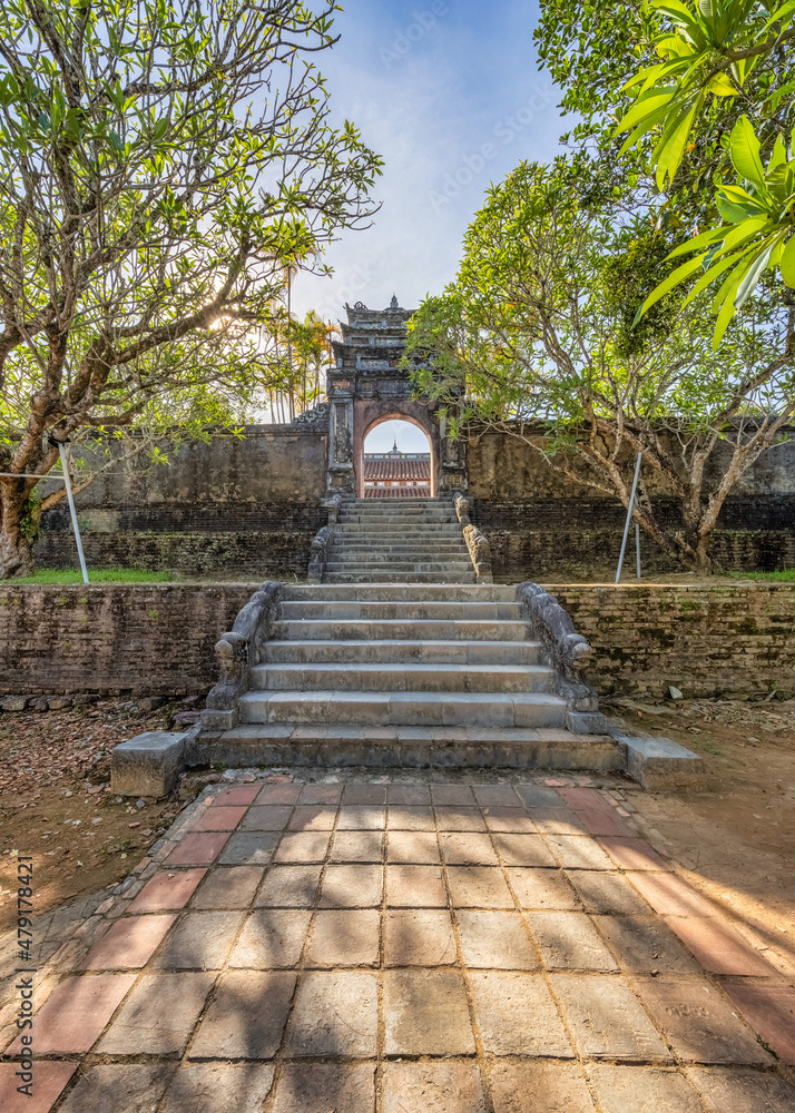 Minh Mang tomb near the Imperial City with the Purple Forbidden City within the Citadel in Hue, Vietnam. Imperial Royal Palace of Nguyen dynasty in Hue. Hue is a popular Minh Mang tomb near the Imperial City with the Purple Forbidden City within the Citadel in Hue, Vietnam. Imperial Royal Palace of Nguyen dynasty in Hue. Hue is a popular