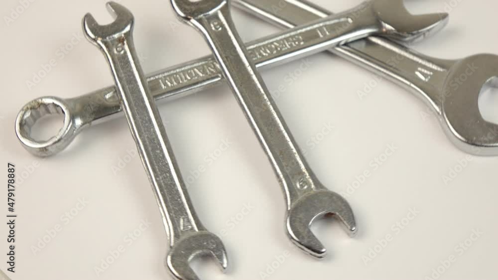 Wrenches on rotating background. Work tools Wrenches on rotating background. Work tools