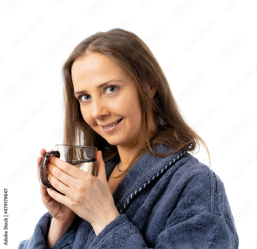 A woman in a bathrobe holds a mug of water. A man drinks a lot of water. He drank a lot and sat at home. close-up. isolated. A woman in a bathrobe holds a mug of water. A man drinks a lot of water. He drank a lot and sat at home. close-up. isolated.