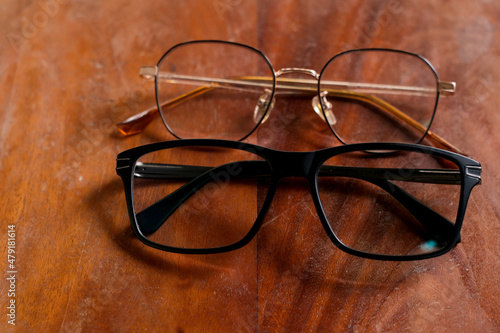 A pair of glasses on a wooden table