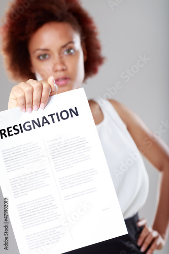 Angry determined young Black woman with Resignation sign