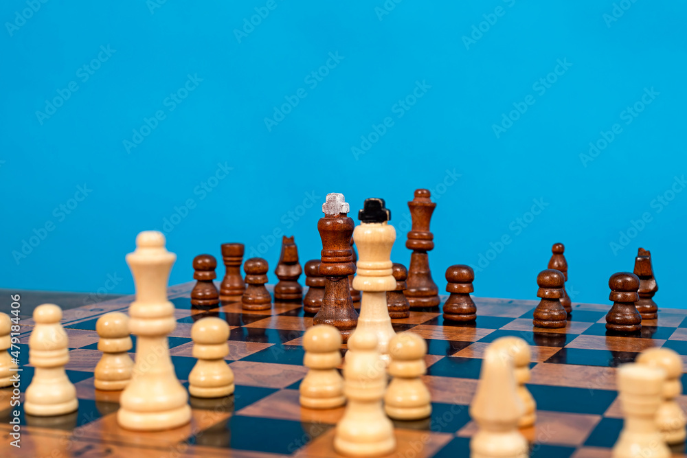 On the chessboard there are two kings and their troops opposite each other.