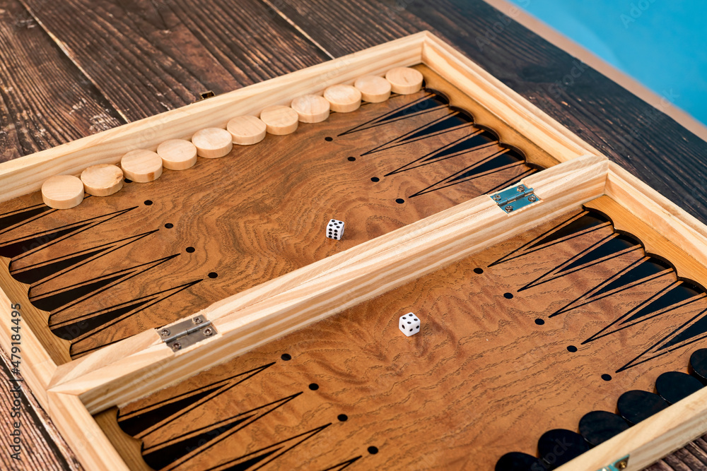 Dice on the backgammon board on the background. Dice on the backgammon board on the background.