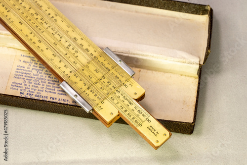 Old fashion slide rule for measurement and calculation photo