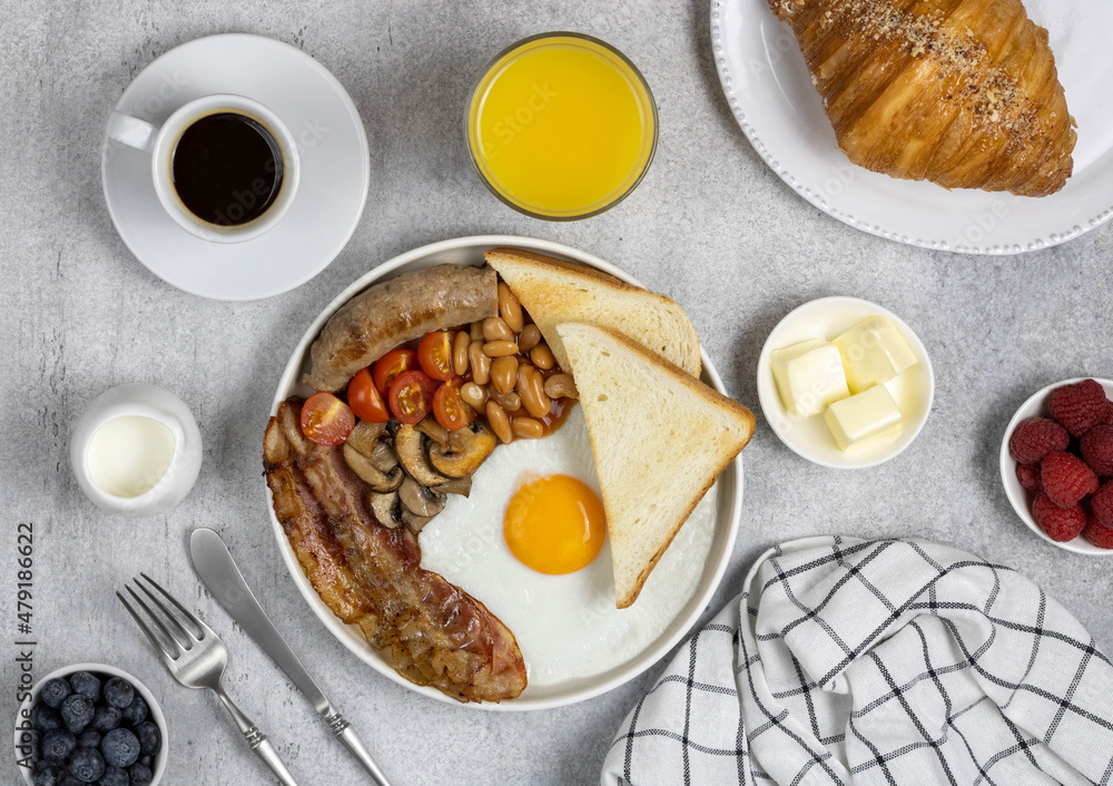 Traditional full english breakfast on a wooden background Traditional full english breakfast on a wooden background