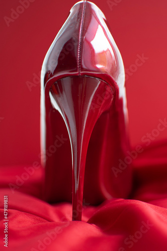 red shoe on a satin