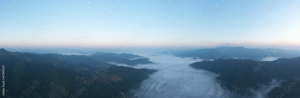aerial view from drone panoramic landscape morning natural light blue sky and mountain range with fog in valley at chiang rai Thailand,