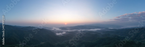 panoramic aerial landscape view morning sunlight blue sky and mountain range with fog in valley at chiang rai Thailand 