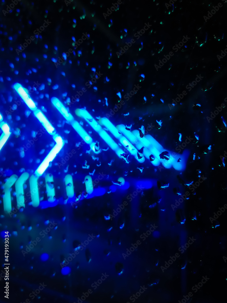 Abstract background with LED light and water streaks on the glass Abstract background with LED light and water streaks on the glass