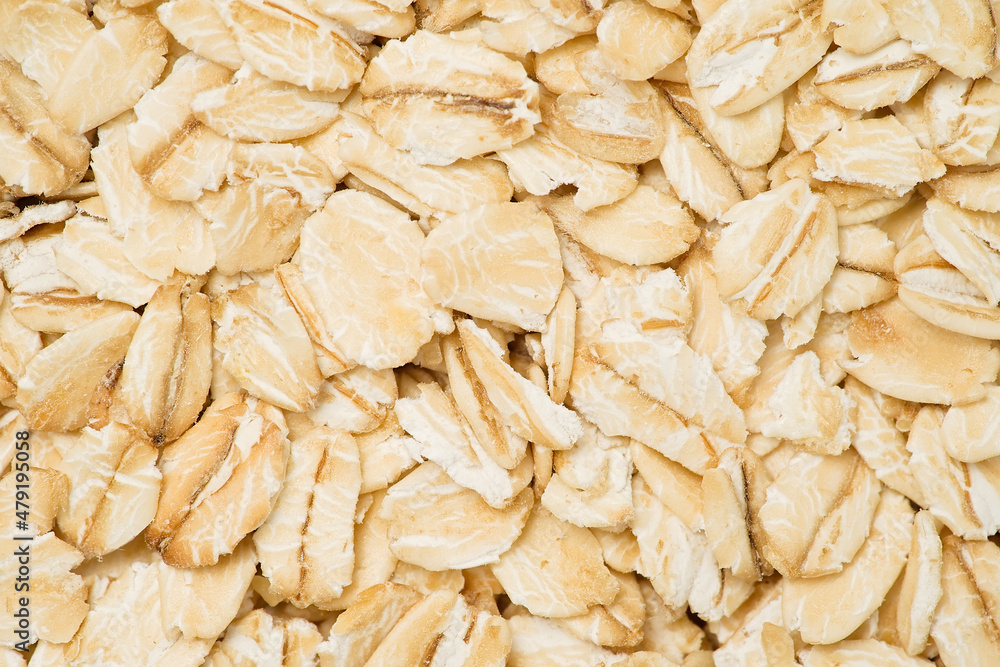 Rolled oat, oat flakes background or texture. Macro, top view Rolled oat, oat flakes background or texture. Macro, top view
