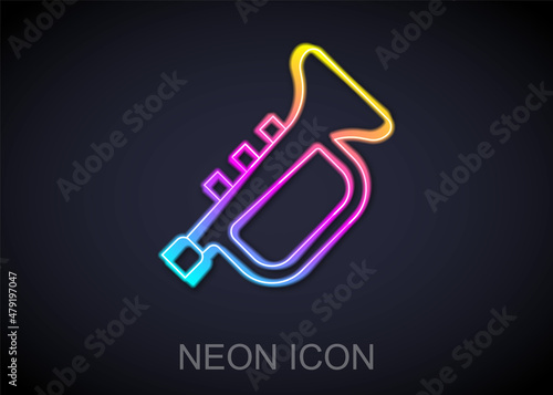 Glowing neon line Musical instrument trumpet icon isolated on black background. Vector