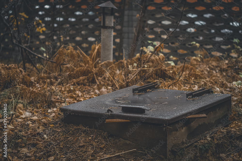 Cellar hatch in the ground. Place of storage of vegetables and stocks for the winter. Emergency shelter. Cellar hatch in the ground. Place of storage of vegetables and stocks for the winter. Emergency shelter.