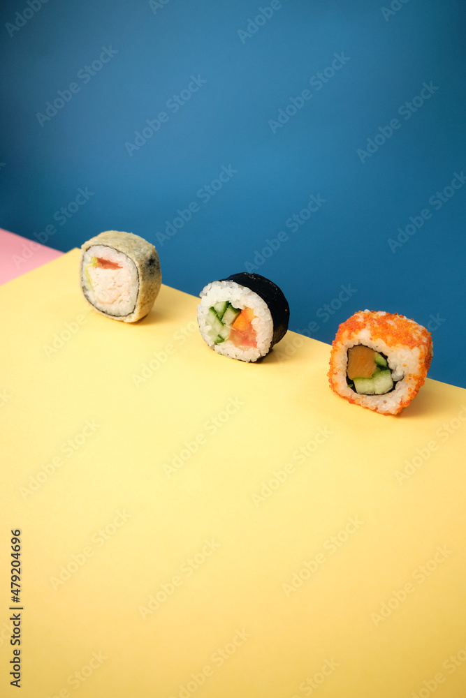 sushi rolls on a color background, minimalism