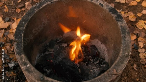 embers smouldering in the fire, a small explosion, a cooking fire was built in a concrete pipe