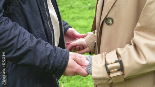 A young couple holding hands, it seems to be love at first sight