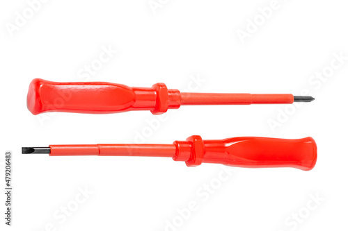Two red flat screwdrivers covered with plastic insulation. Close-up isolated on white background.